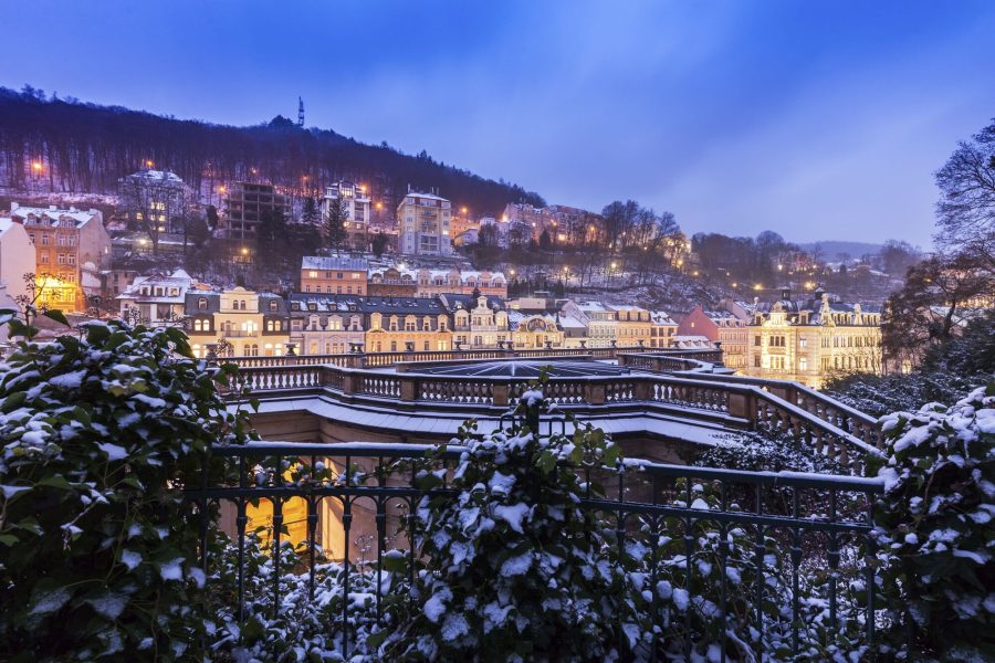 Guided tour group exploring Karlovy Vary’s elegant promenade